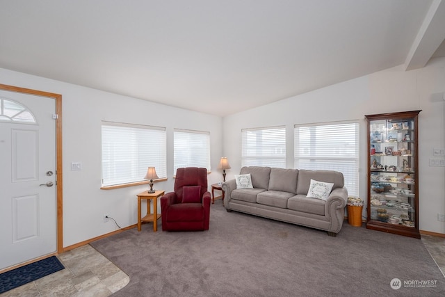 living room with vaulted ceiling and light colored carpet