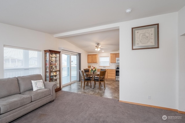 carpeted living room featuring lofted ceiling with beams and ceiling fan