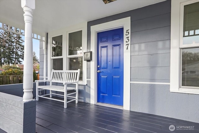 property entrance featuring covered porch