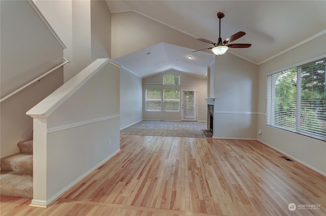 unfurnished living room with ceiling fan, a healthy amount of sunlight, and light wood-type flooring