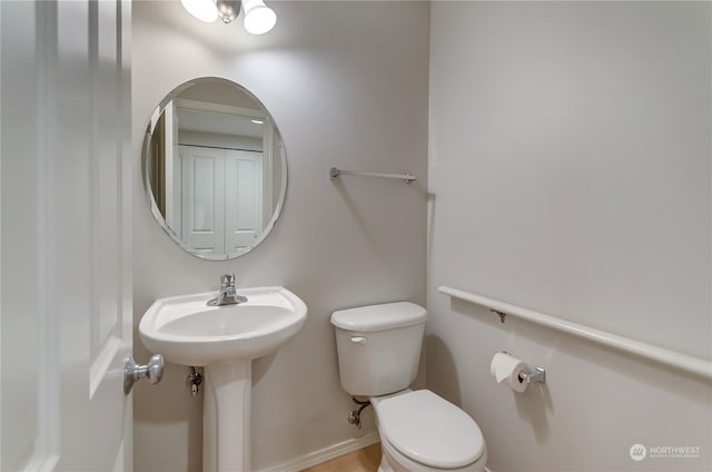 bathroom with toilet and sink