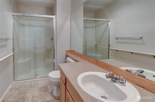 bathroom with vanity, toilet, and walk in shower