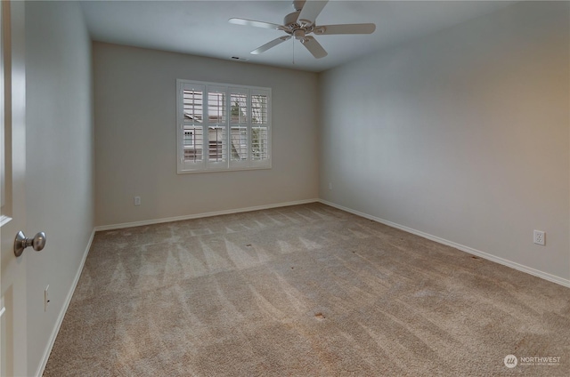 empty room with light carpet and ceiling fan