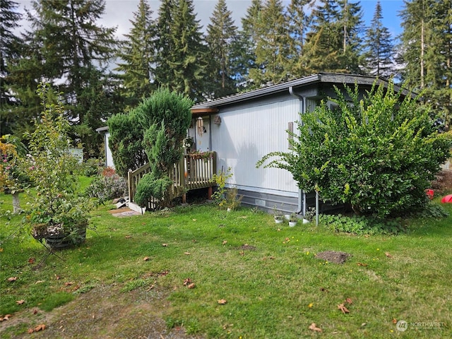 view of property exterior featuring a yard