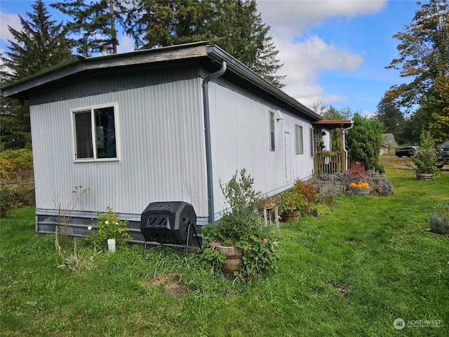 view of property exterior with a lawn