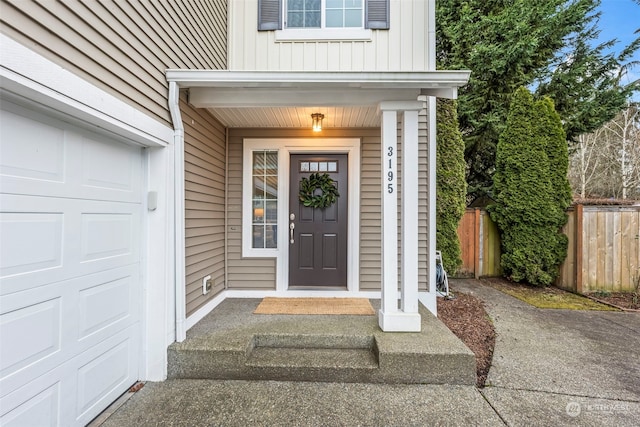 doorway to property featuring a garage