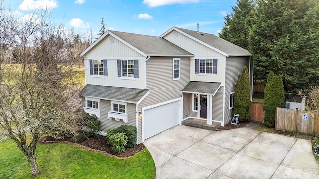 front of property with a garage and a front lawn