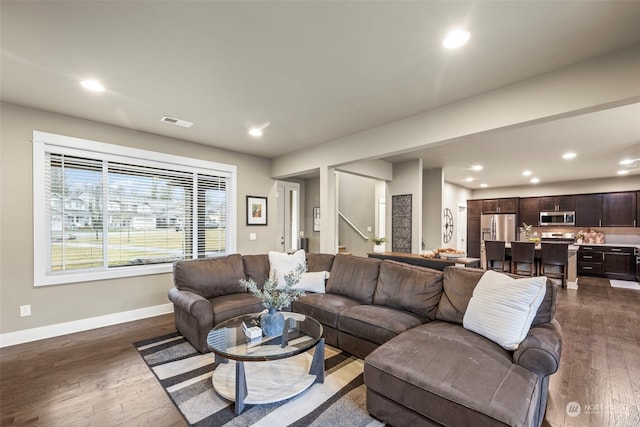 living room featuring dark hardwood / wood-style floors