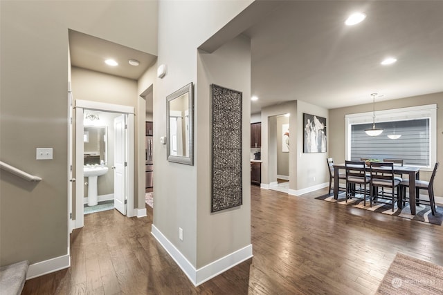 hall featuring sink and dark hardwood / wood-style floors