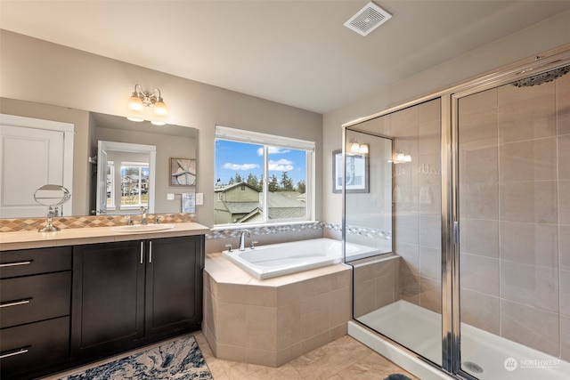 bathroom with vanity, separate shower and tub, and tile patterned flooring