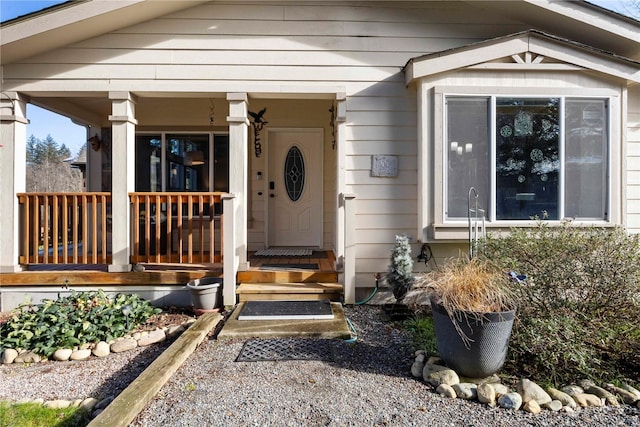 property entrance with covered porch