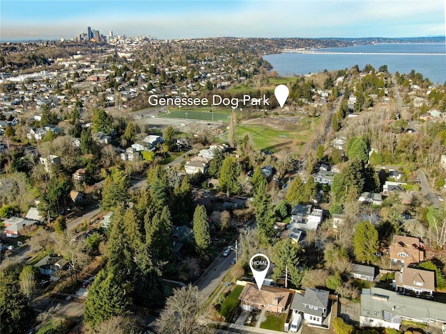 drone / aerial view featuring a water view and a residential view