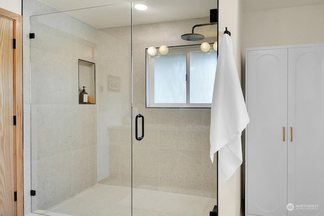 bathroom with a shower stall