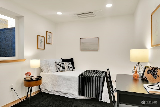 carpeted bedroom with visible vents and recessed lighting