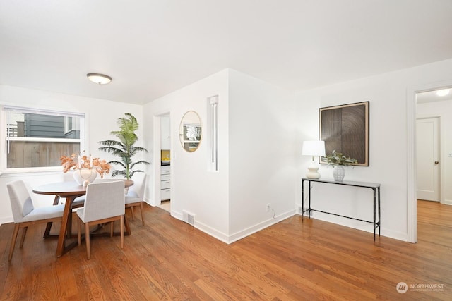 dining room featuring wood-type flooring