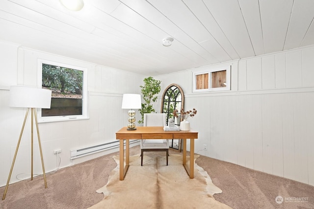 office area featuring a wealth of natural light, a baseboard radiator, and carpet