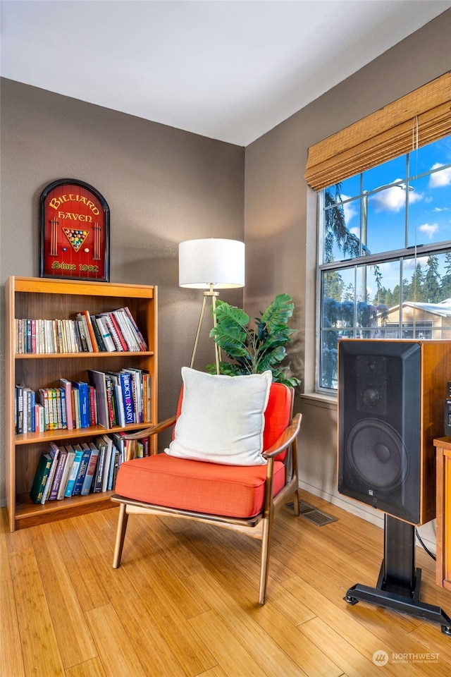 sitting room featuring hardwood / wood-style flooring