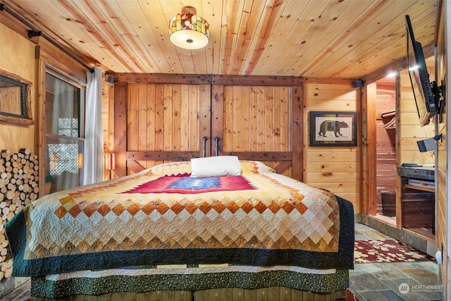 bedroom featuring wooden walls and wooden ceiling