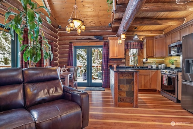 kitchen with french doors, sink, wood ceiling, pendant lighting, and stainless steel appliances