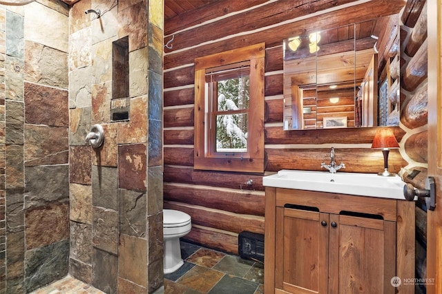 bathroom with vanity, log walls, and toilet