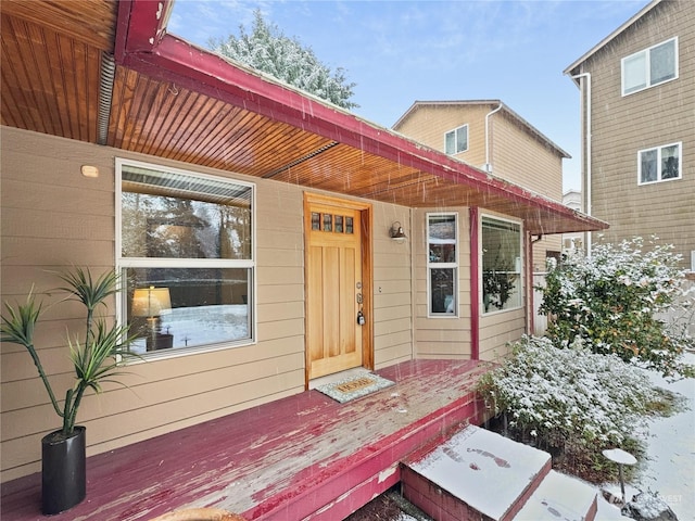 view of snow covered property entrance