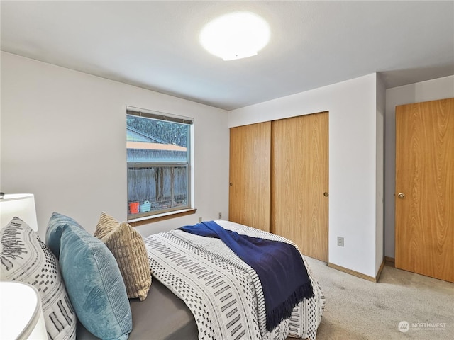 carpeted bedroom featuring a closet