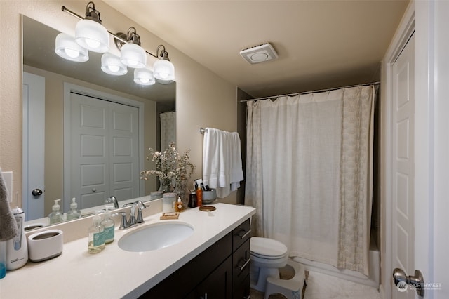 full bathroom featuring vanity, shower / tub combo, and toilet