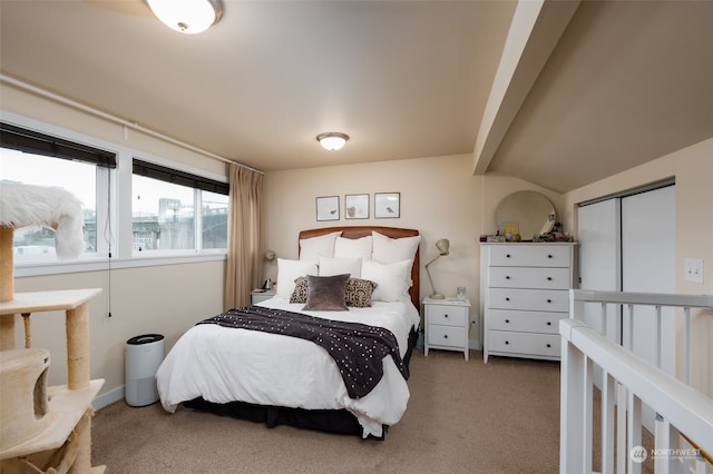 bedroom featuring carpet floors and lofted ceiling with beams