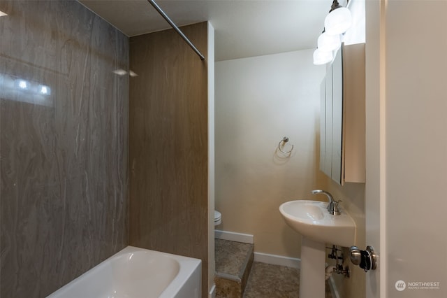 bathroom featuring bathing tub / shower combination and toilet