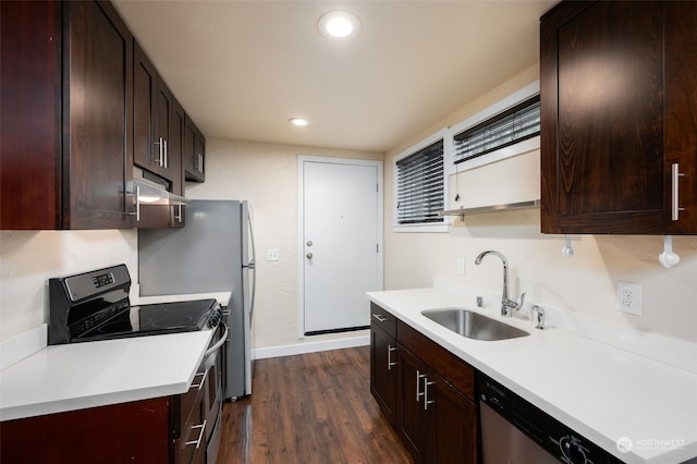 kitchen featuring sink, dark wood-type flooring, and appliances with stainless steel finishes