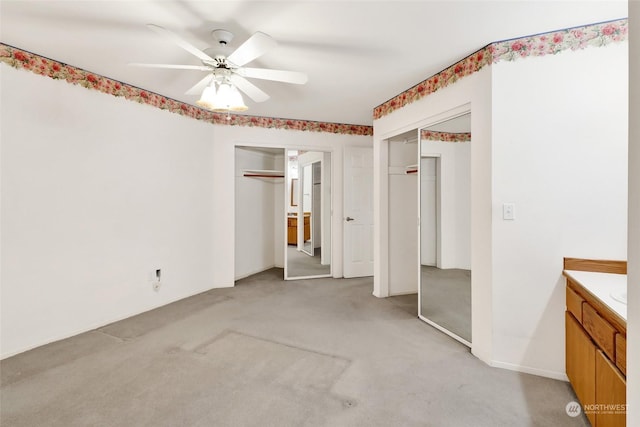 unfurnished bedroom with light carpet and ceiling fan