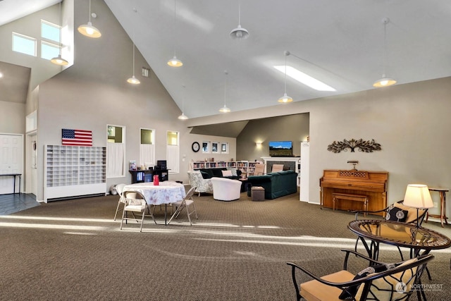 interior space with high vaulted ceiling and a fireplace