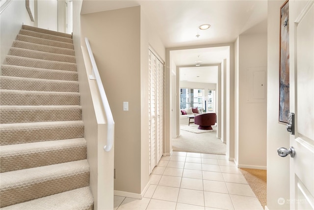 staircase featuring tile patterned floors