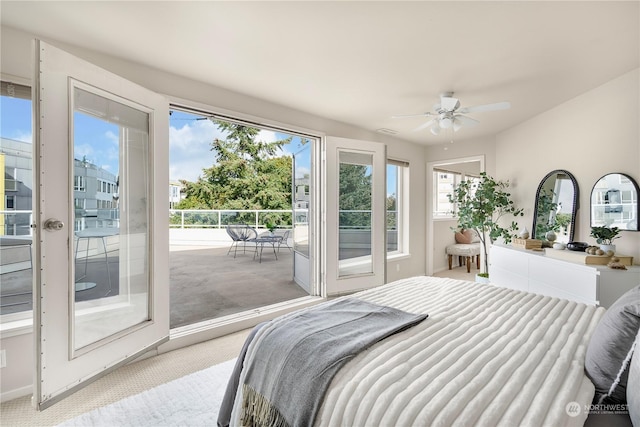 carpeted bedroom with access to exterior