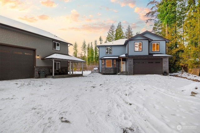 view of front of house with a garage and covered porch