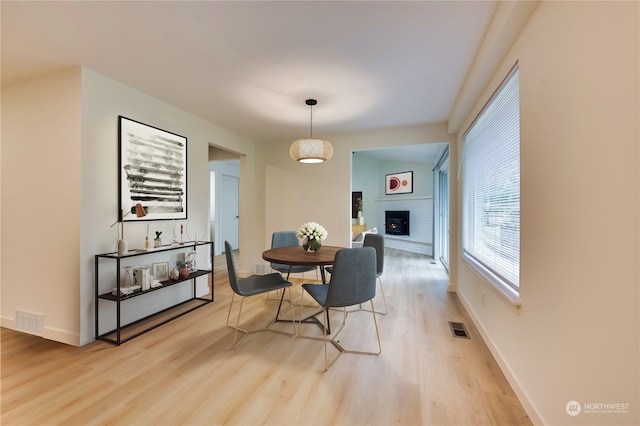 dining area featuring light wood-type flooring