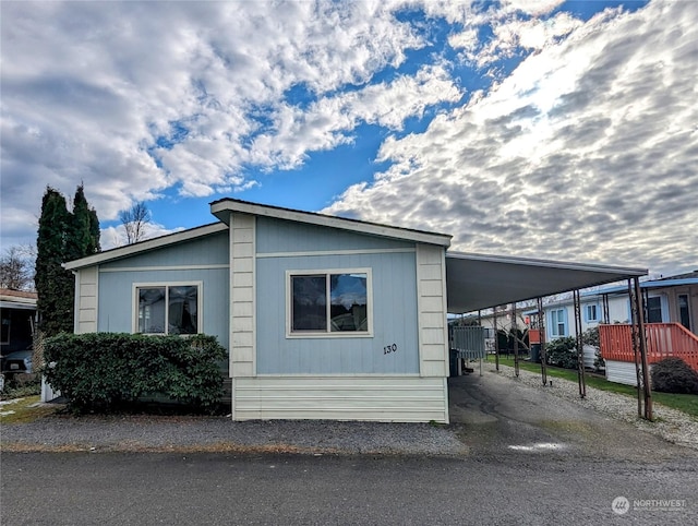 view of property exterior featuring a carport