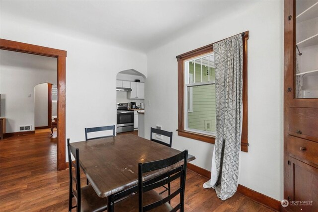 dining area with dark hardwood / wood-style floors