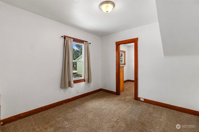 empty room with carpet flooring