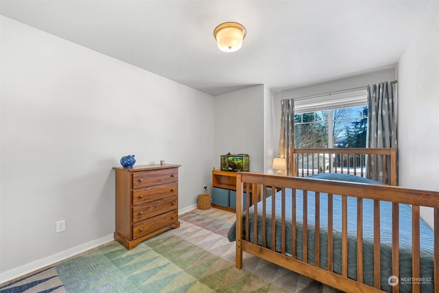 bedroom featuring light carpet