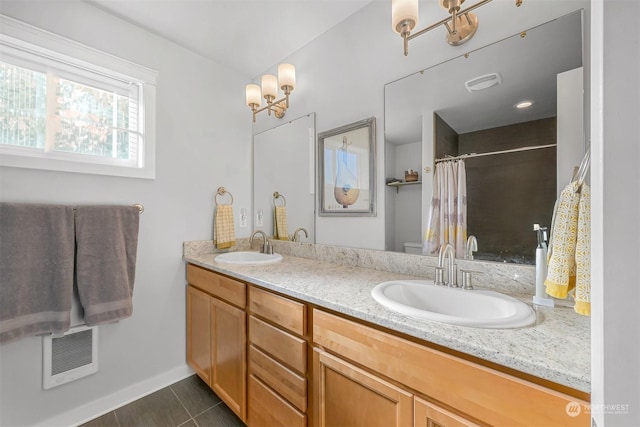 bathroom with tile patterned floors, vanity, and toilet