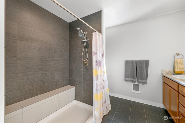 bathroom featuring tile patterned flooring, vanity, and a shower with curtain