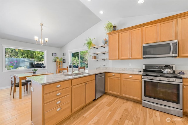 kitchen with lofted ceiling, sink, stainless steel appliances, light hardwood / wood-style floors, and kitchen peninsula