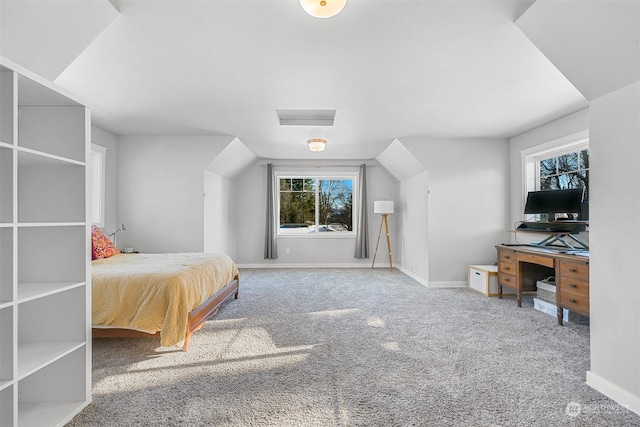 bedroom with vaulted ceiling and carpet