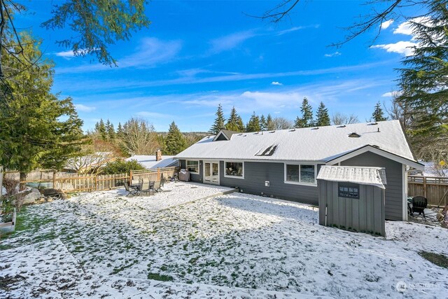 view of snow covered house