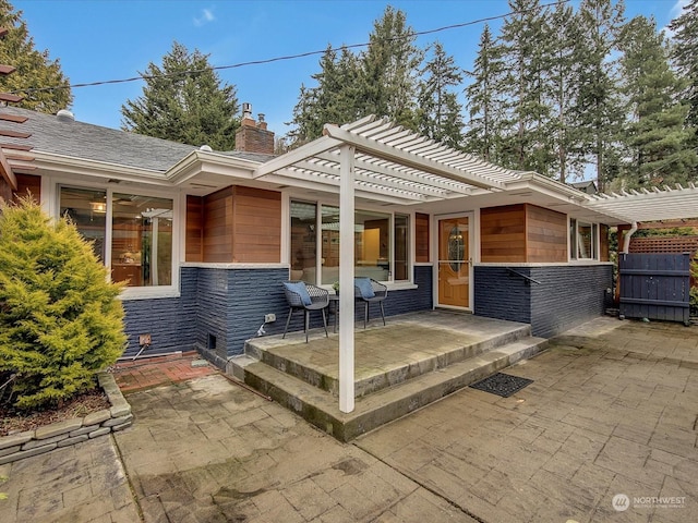 exterior space featuring a pergola and a patio