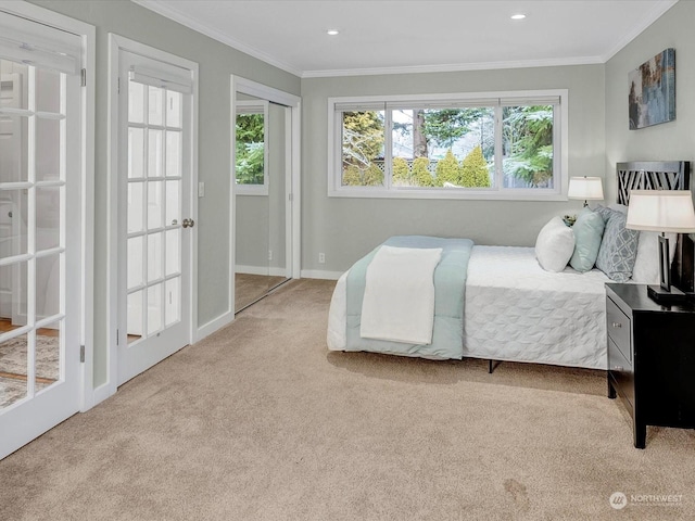 bedroom with light carpet and ornamental molding