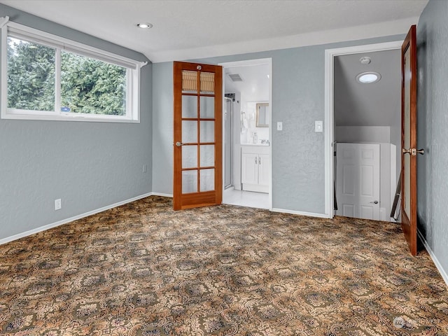 unfurnished bedroom featuring dark colored carpet