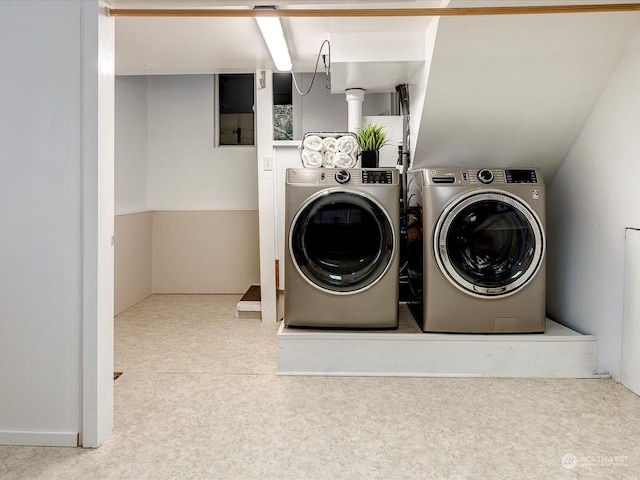 washroom with washing machine and dryer