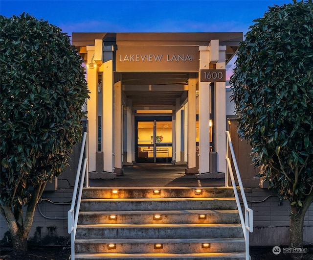 view of exterior entry at dusk